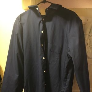 Dark blue button down long sleeve shirt.